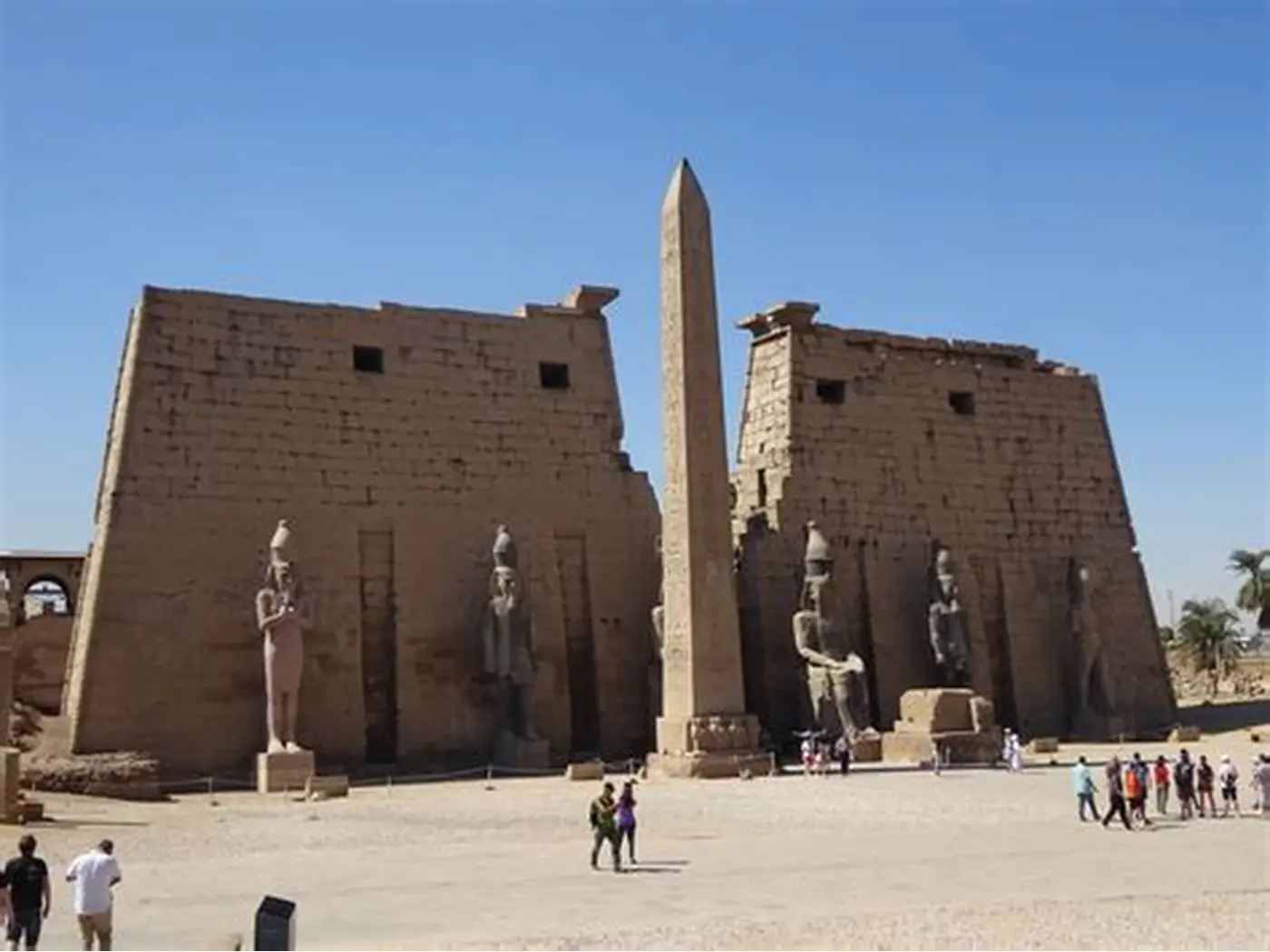 The grand entrance pylon of Luxor Temple with one of the two obelisks still standing.