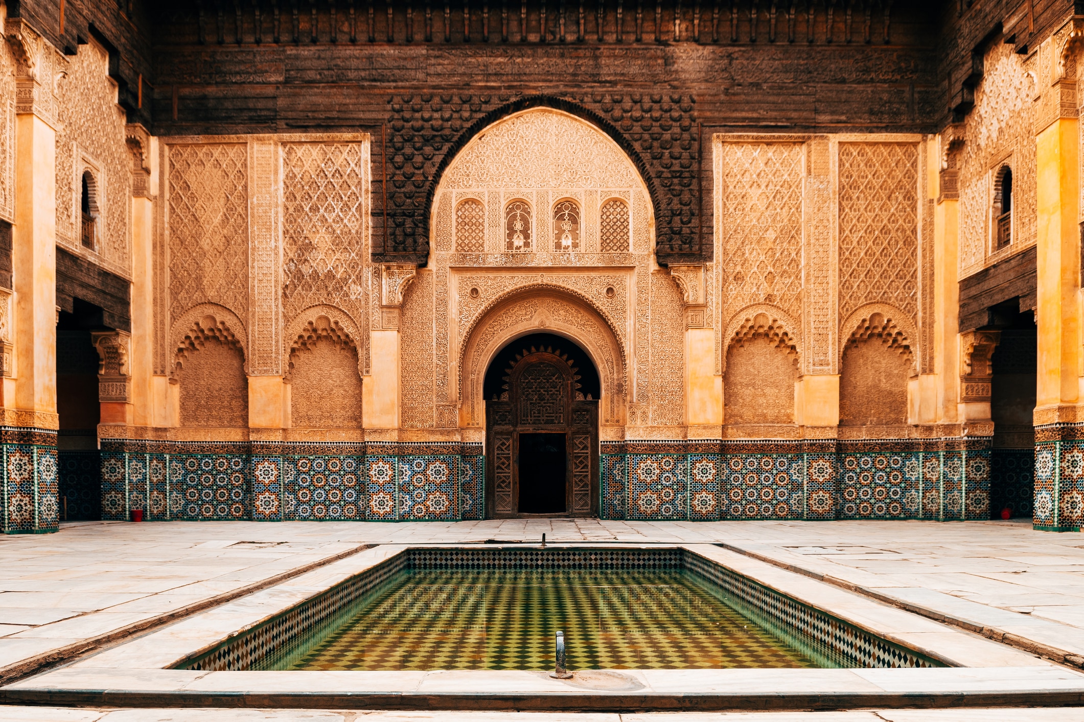 The intricate and beautiful courtyard of the Ben Youssef Madrasa.