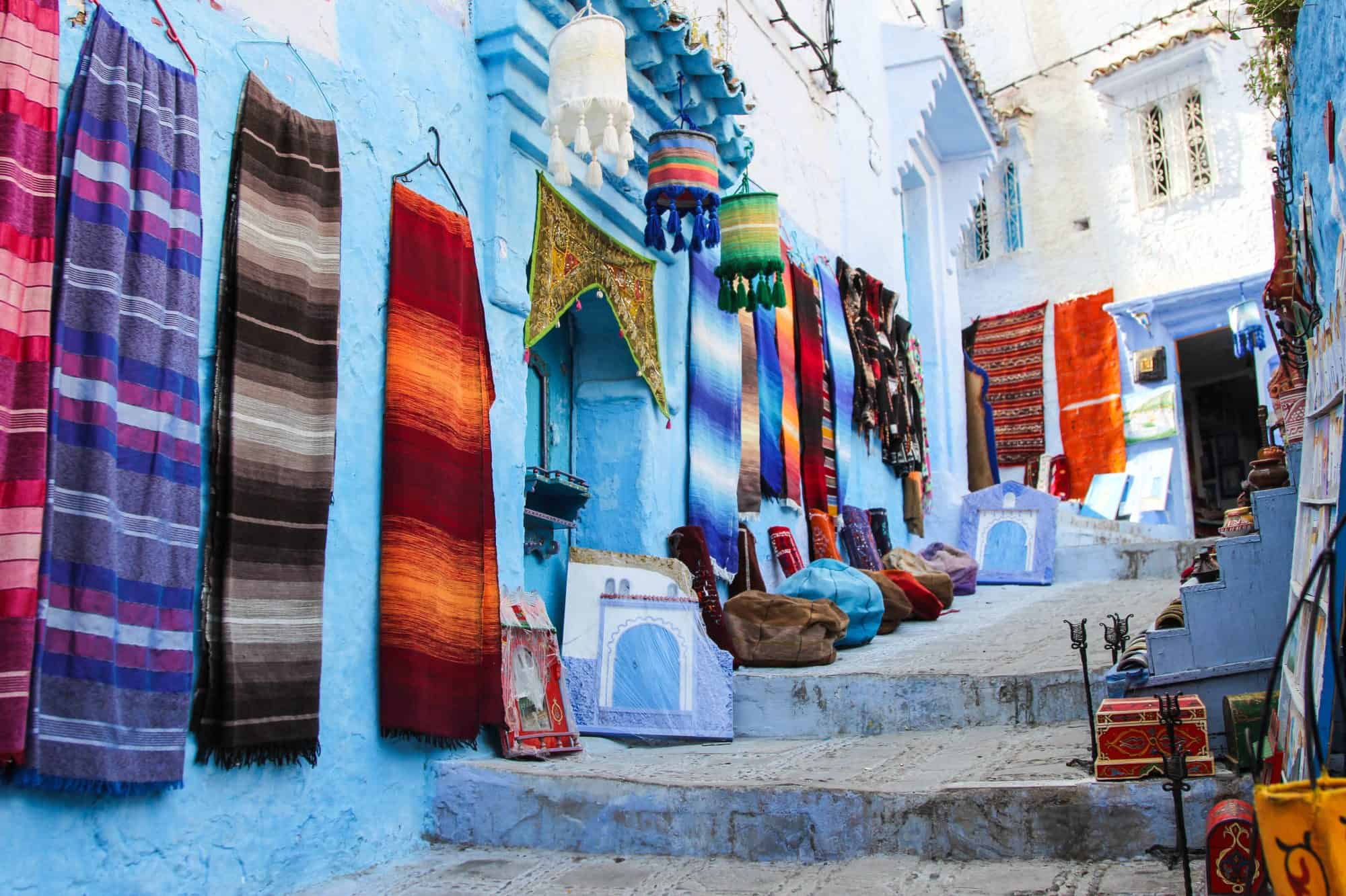 A market stall in Chefchaouen selling colorful traditional goods.