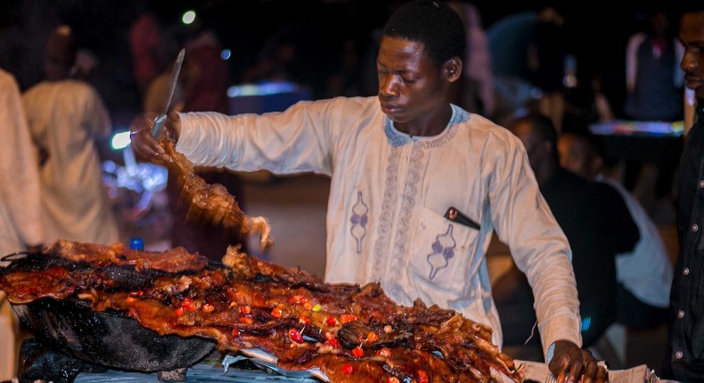 A photo of Nigerian Suya skewers being grilled