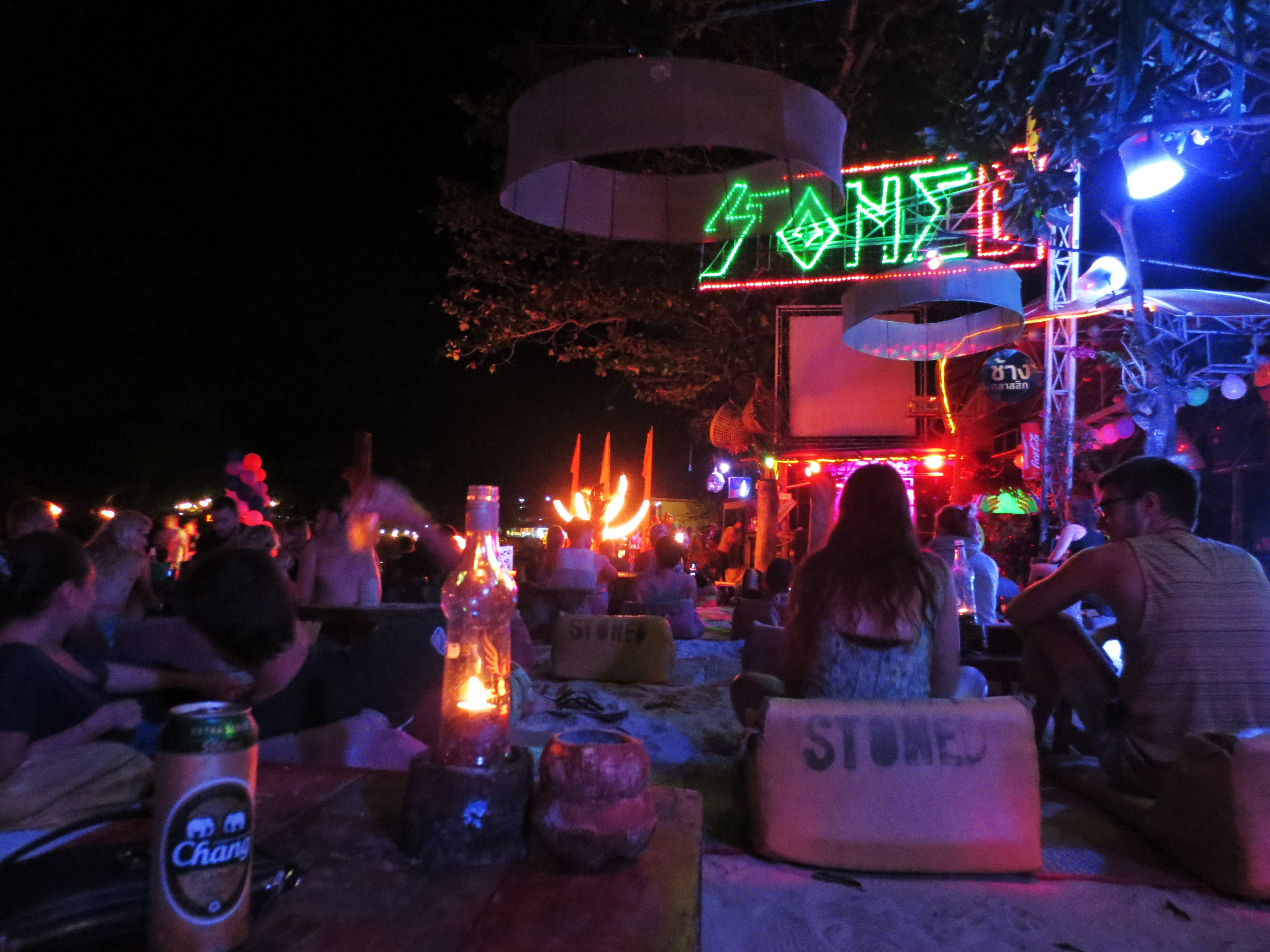 The vibrant beach nightlife at Loh Dalum Bay with fire shows.